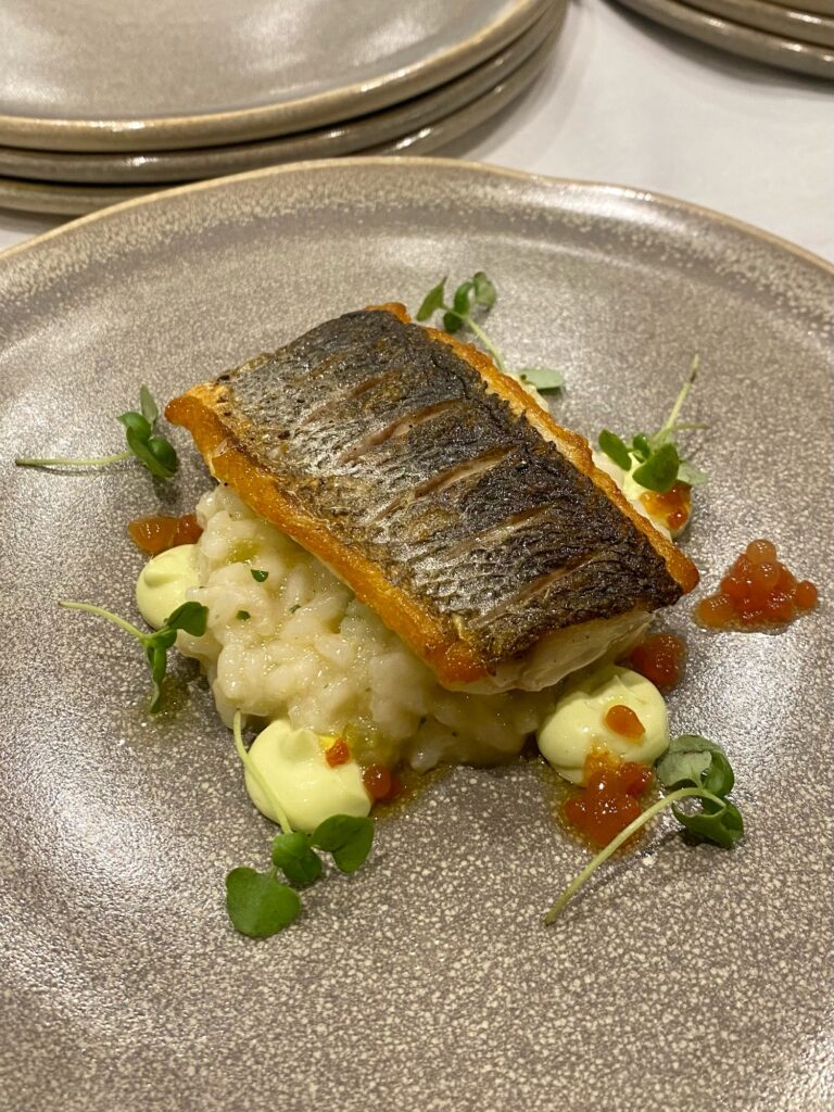 perfectly cooked fish on risotto