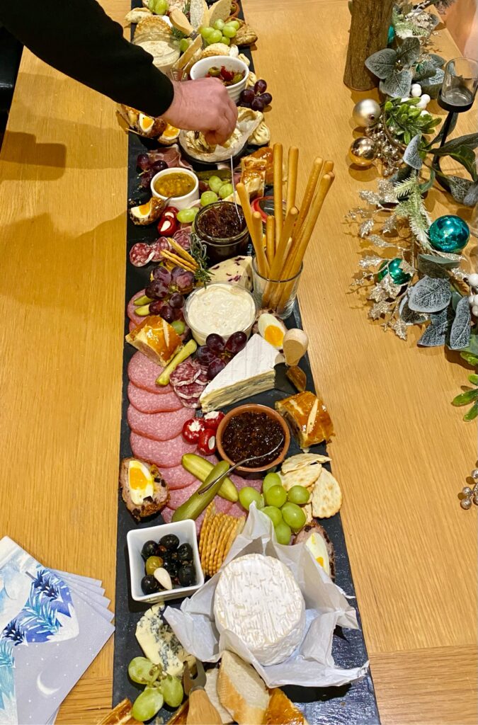 sharing platter full of meat, cheese and crackers