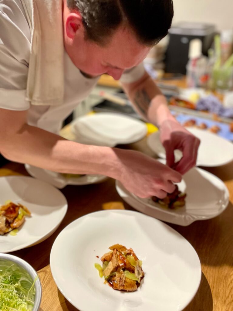 chef finishing off starter