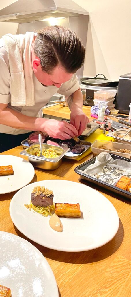 chef checking meat is cooked to perfection