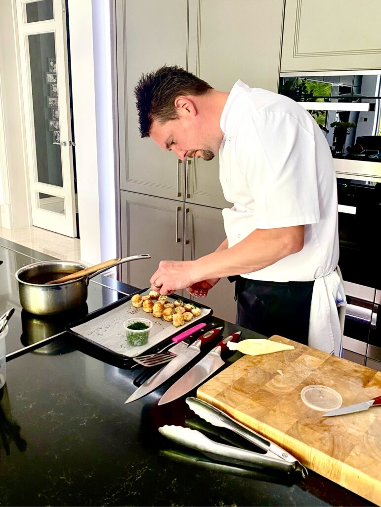 chef preparing what looks like a scone or profiterole